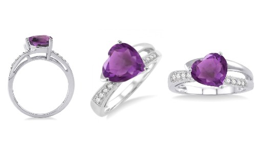 An amethyst heart shaped stone on a side stone ring