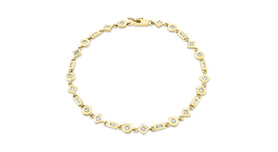 a yellow gold bracelet featuring bezel-set diamonds