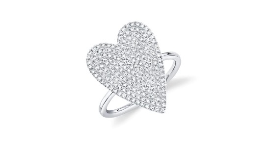 a silver fashion ring with a heart motif covered in pave-set diamonds.