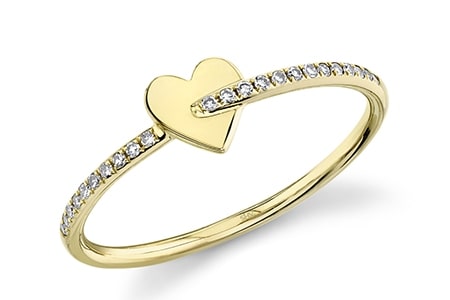 a minimalist fashion ring band that features a heart motif.