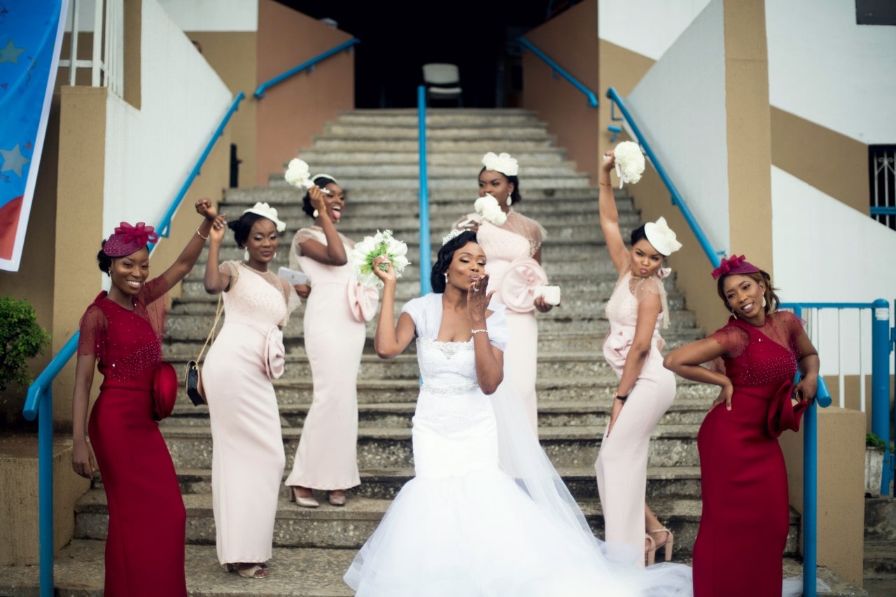 An ensemble of bridesmaids celebrate the bride before the ceremony.