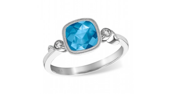 a white gold fashion ring featuring a blue topaz center stone