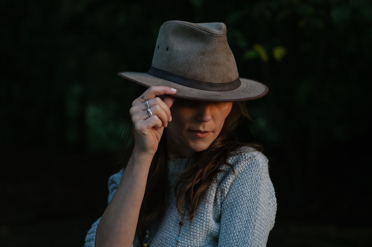 woman with fashion jewelry and hat