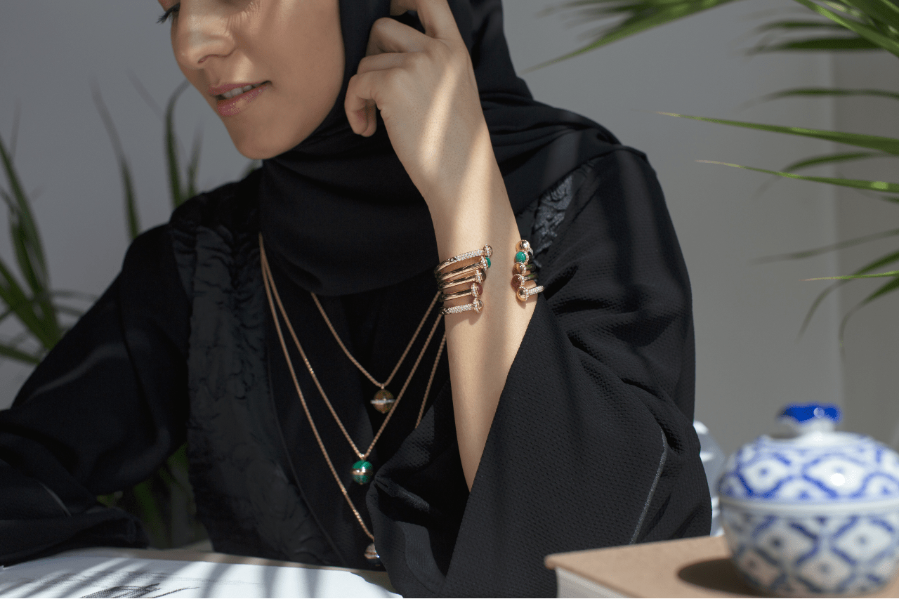 Woman with a bracelet and necklace stack