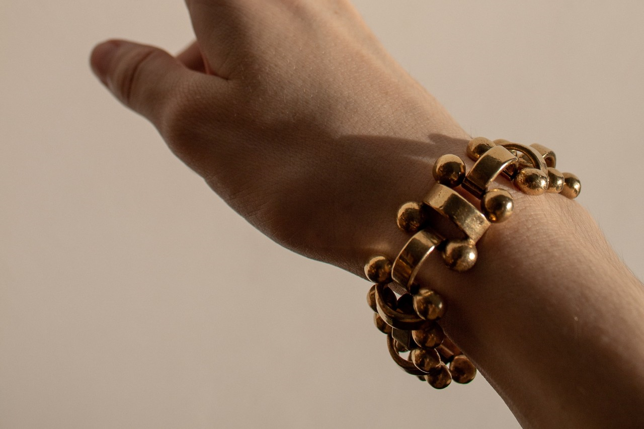 close-up of wrist wearing a bulky bracelet